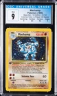 1999 POKEMON BASE SET-1ST EDITION-COSMOS HOLO-2 PLAYER CD STRTR MACHAMP CGC 9