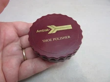 Amtrak logo advertising travel shoe polisher