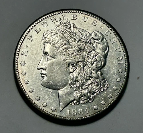 1884 S MORGAN DOLLAR AU