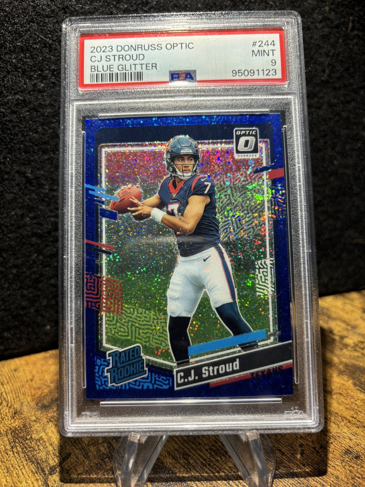 2023 Optic #244 CJ Stroud Texans Blue Glitter Rated Rookie PSA 9