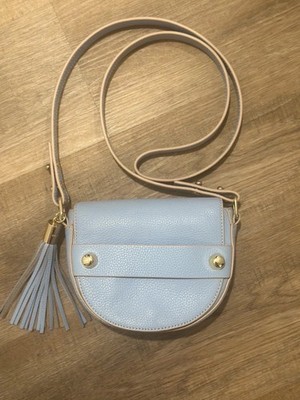 milly  astor  small saddle bag powder blue with tassel detail and magnetic flap