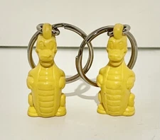 Set Of 2 Vintage TUPPERWARE Keychain DOUGLAS DIRTWALKER Yellow Dinosaur