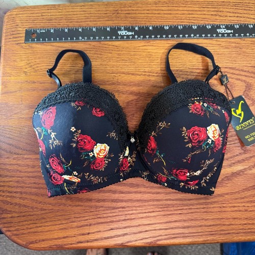 Black padded underwire bra with red rose floral print, black lace trim, and yellow “Binnys” tag on front.