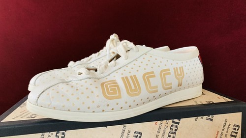 sneakers with bee logo