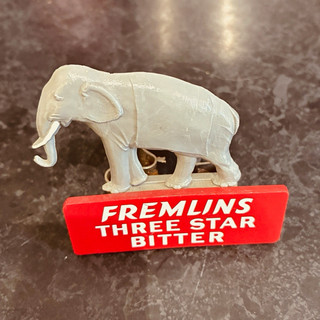 Rare vintage Fremlins three star bitter bottle clip advertising elephant figure.