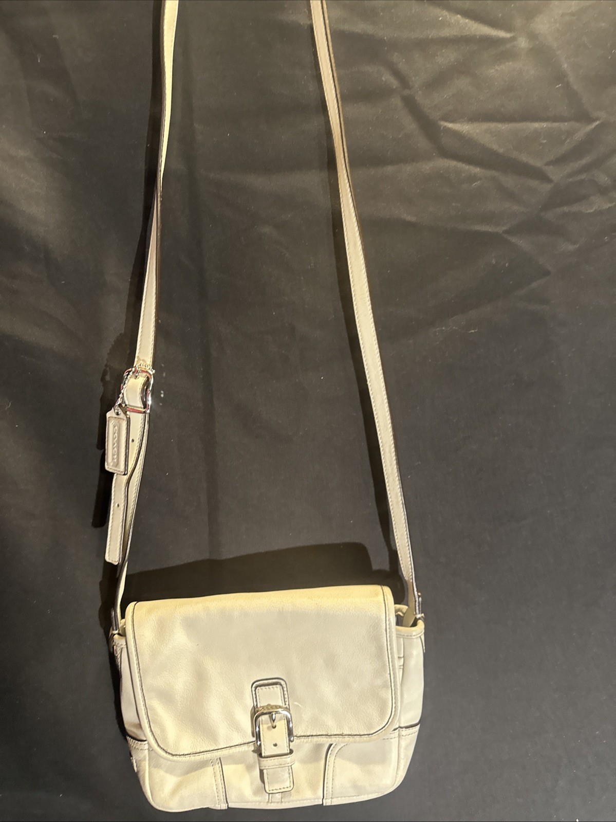 Cream leather Coach crossbody bag with adjustable strap  