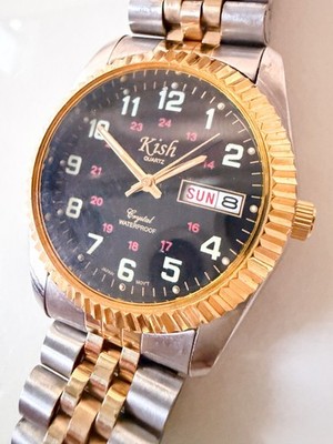Super Clean Men's Kish watch black face, gold bezel, two tone band - Rare Find!
