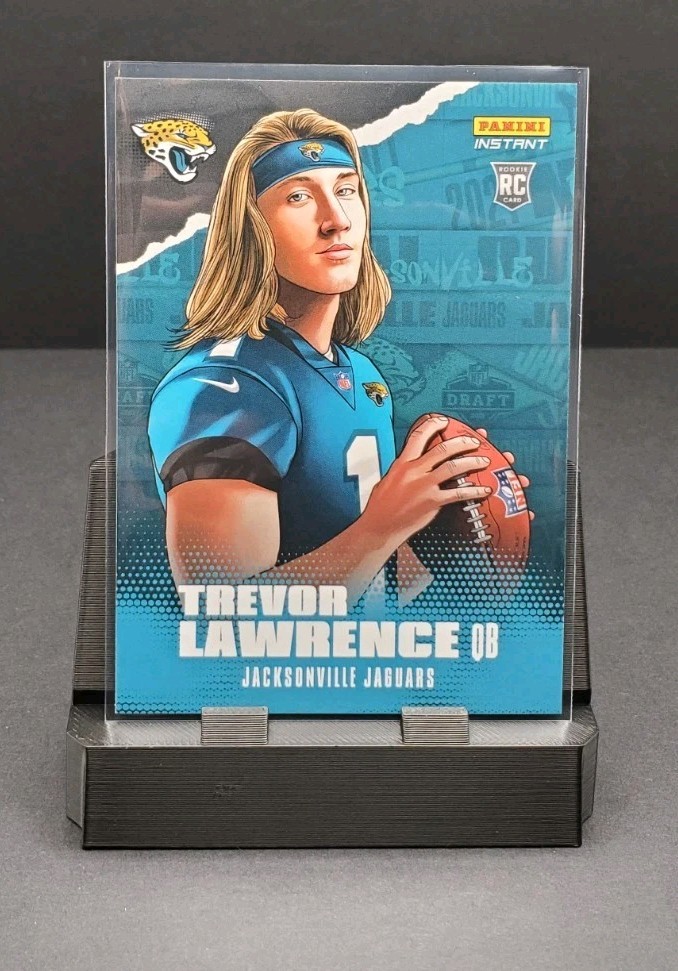 Trevor Lawrence #IS-TL Football Cards 2021 Panini Instant Illustration Series trading card — raw and PSA graded price guide