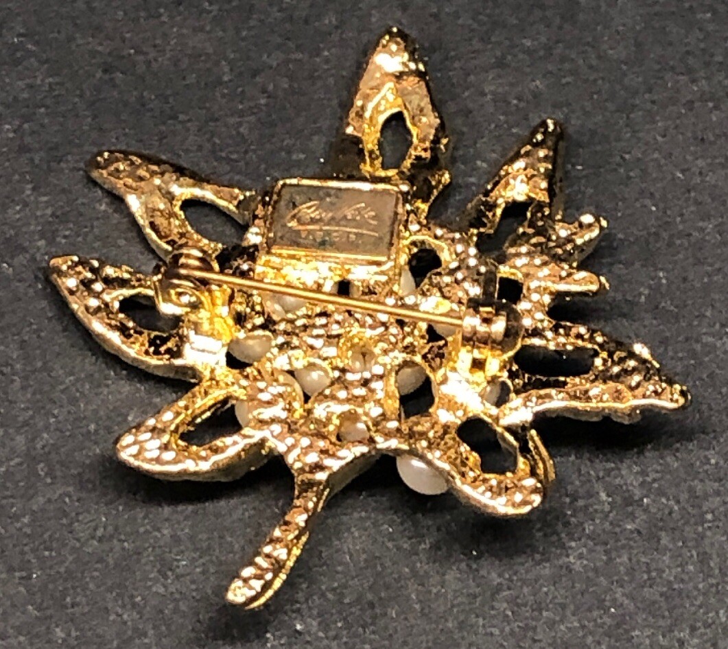 Broche ronde pierres bleues et métal doré à Aiguillon | Clasf mode