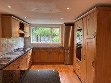 Magnet Vicenza Range Solid Oak Kitchen Units and Laminated Gloss Worktops Used