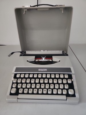 Vintage:  SILVER portable Typewriter with Carrying Case
