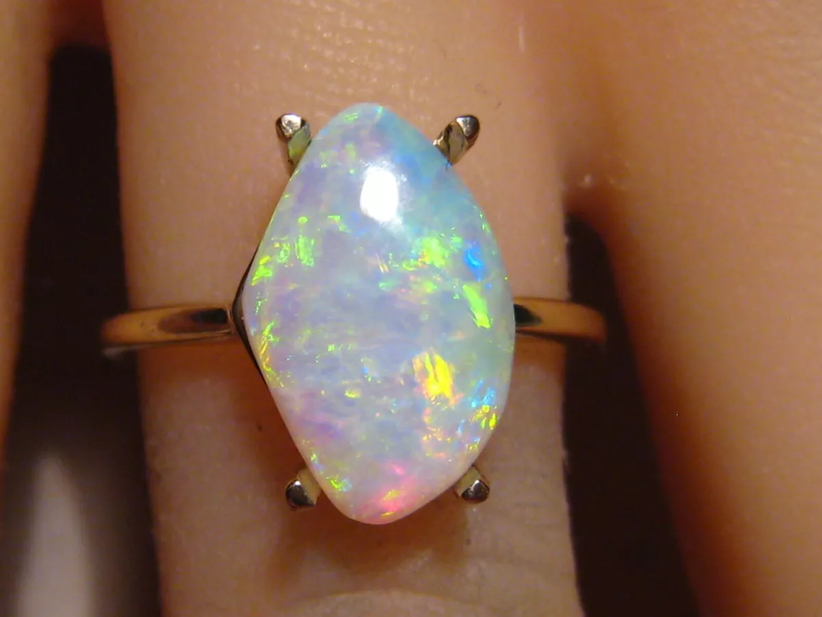 Y)14K 1.18 OPAL .22MTG YELLOW GOLD RING WITH 1.18CT AAA NATURAL AUSTRALIAN  OPAL 22 ROUND DIAMONDS ON THE HALO SETTING TOTALING .22CTS - Royale Jewelers