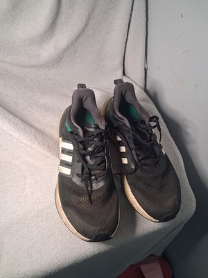 Adidas Equipment Plus running shoes in a black, white, and green colorway.