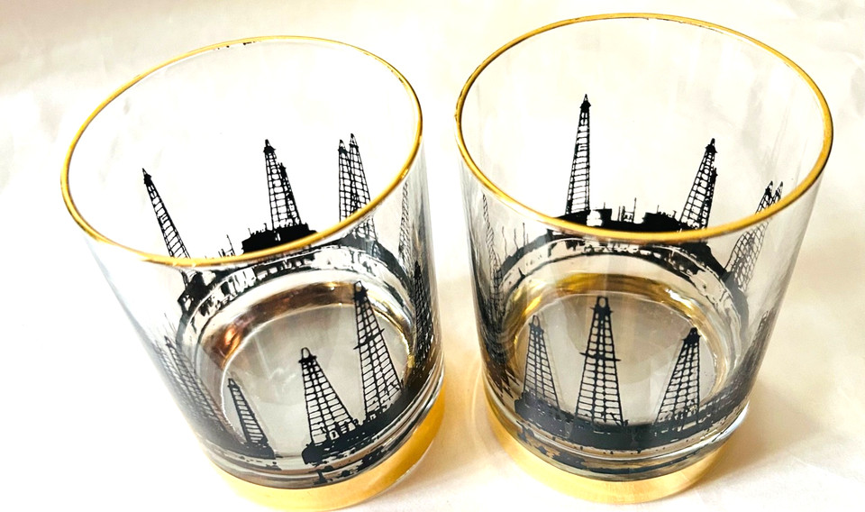 1960s lowball glasses featuring actual oil derrick rigs in 22K gold trim — MCM barware for the person who thinks their bourbon deserves a little petroleum history.