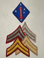 WWII USMC Alpha & Dress Blues Corporal’s Chevrons & 1st. Marine Div. Patch.