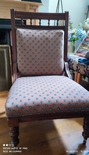 Antique chair recently reupholstered in contemporary blue/brown peacock cotton
