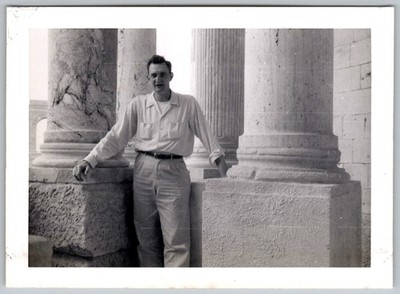Vtg B&W Snapshot Man By Stone Columns 1946