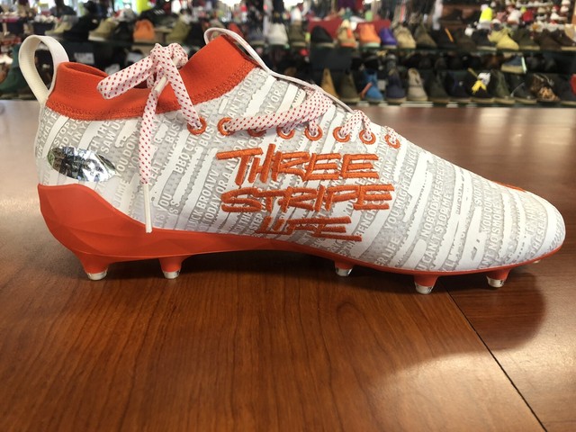 orange adidas football cleats