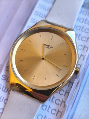 Swatch Irony SYXG100 Reloj Pulsera Cuarzo Oro Silicona Beige Nuevo - Imagen 1 de 2