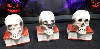 Set Of 3 Japan Halloween Bisque Skull On Book Match Stick Candle Holders