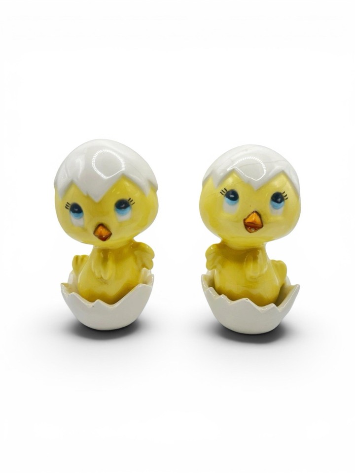 Googly-eyed anthropomorphic chick figurines hatching from eggs — pure mid-century kitsch that belongs on a shelf next to a lava lamp.
