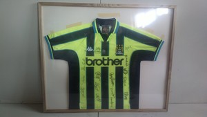 framed man city shirt