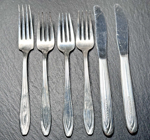 SIX PIECE NATIONAL AIRLINES FLATWARE COLLECTION: 2 KNIVES, 3 SALAD FORKS, 1 FORK