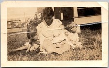 Vtg Snapshot Mother With Three Young Children Sitting in Grass Yard 1920s