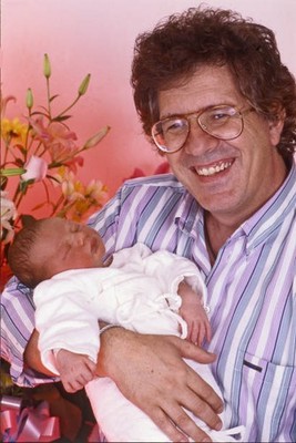 The Italian singer Peppino di Capri poses smiling holding his newb- Old Photo