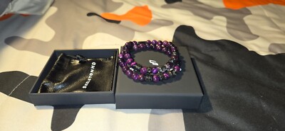 skeletonhd bracelet purple stack + Green and gold stack