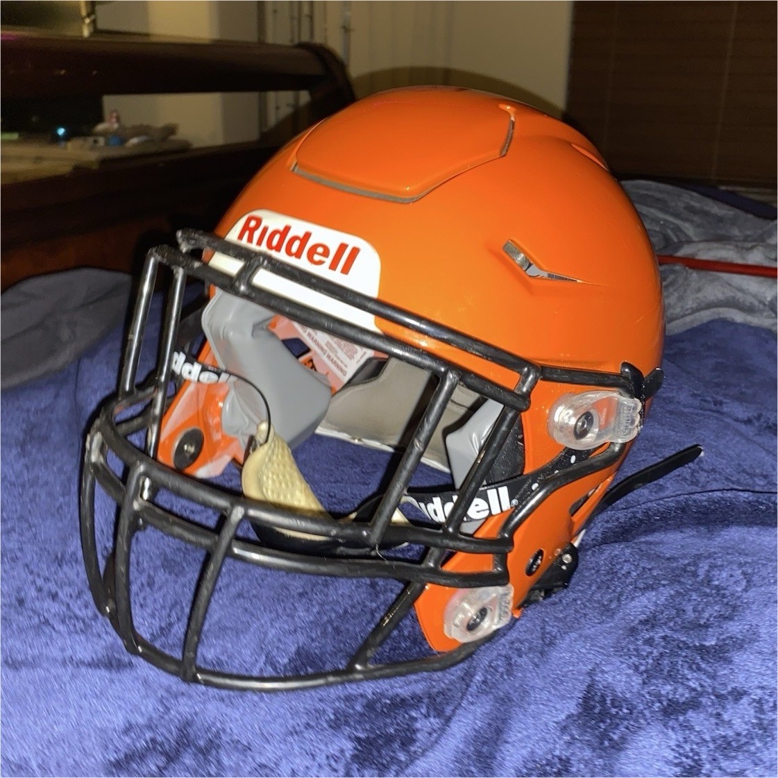 black and orange football helmet Riddell Full Face Orange Football Helmet with Black Face Mask
