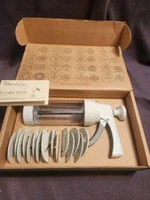The Pampered Chef 1525 Cookie Press with 16 Discs - White