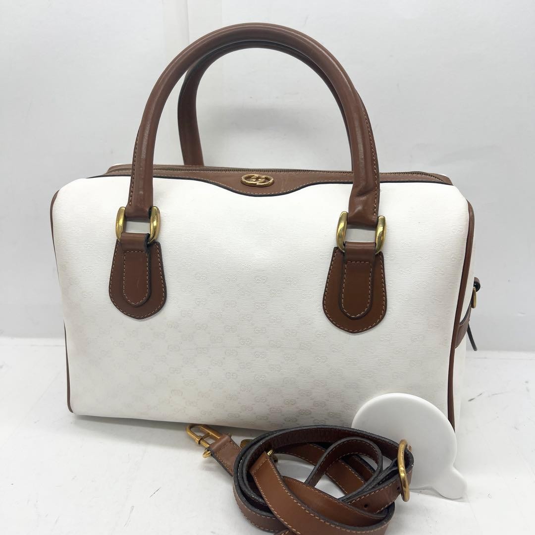 Borsa Gucci Mini Boston Micro GG ad incastro in pelle tela bianca marrone