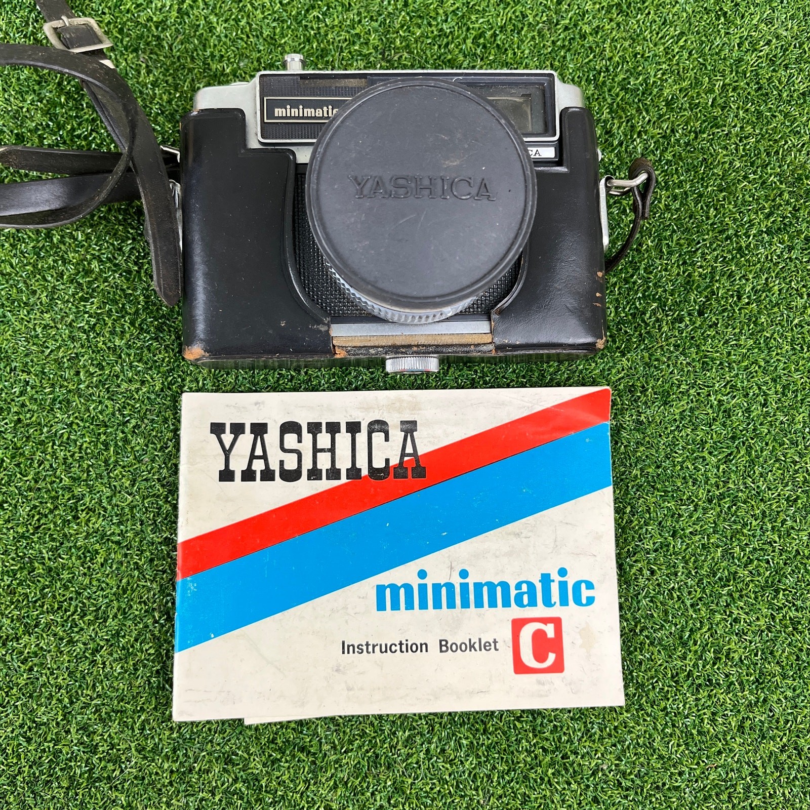 Vintage Yashica Minimatic-C 35mm rangefinder film camera with instruction booklet
