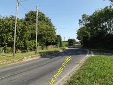 Photo 12x8 B1134 Long Row, Goose Green Goose Green/TM1187 At the junction c2016