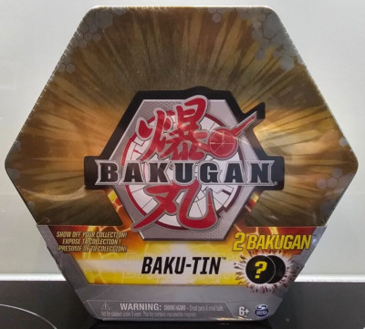 Bakugan Baku-Tin Metall-Aufbewahrungsbox Gold mit 2 Überraschungs-Bakugans