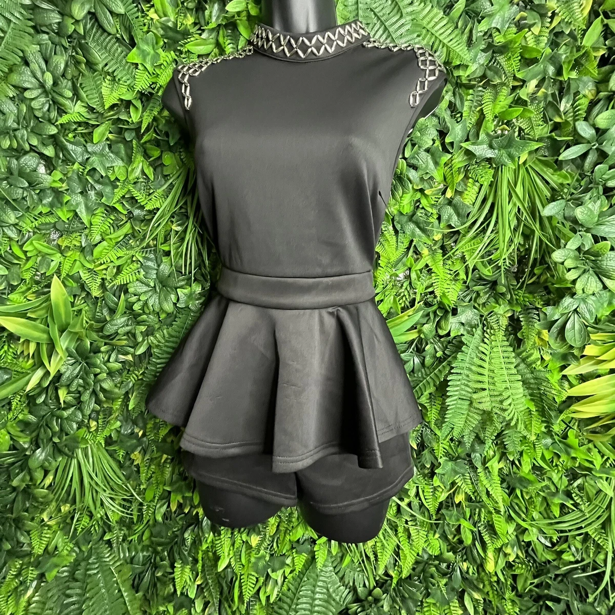 Sleeveless Romper With Peplum Hem In Black