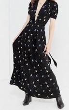 Maxi Dress, Nipped Waisted, Belt at The Waist That Ties At Reverse.