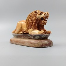 hand carved olive wood sculpture of a lion Roaring