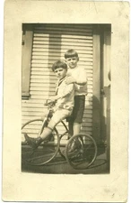 Pre 1920 unused postcard two boys on a tricycle real photo