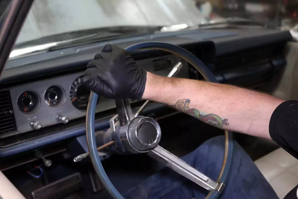 After the steering wheel is turned 20 times, lock to lock, the power steering lines should be bled.