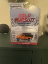 Greenlight Cold Pursuit 2010 Jeep Wrangler Unlimited chase blue machine.