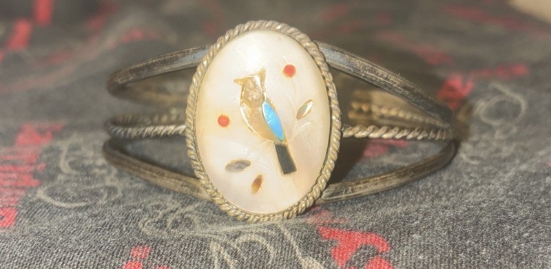 sterling silver cuff bracelet features a traditional Zuni-style Stone Inlay