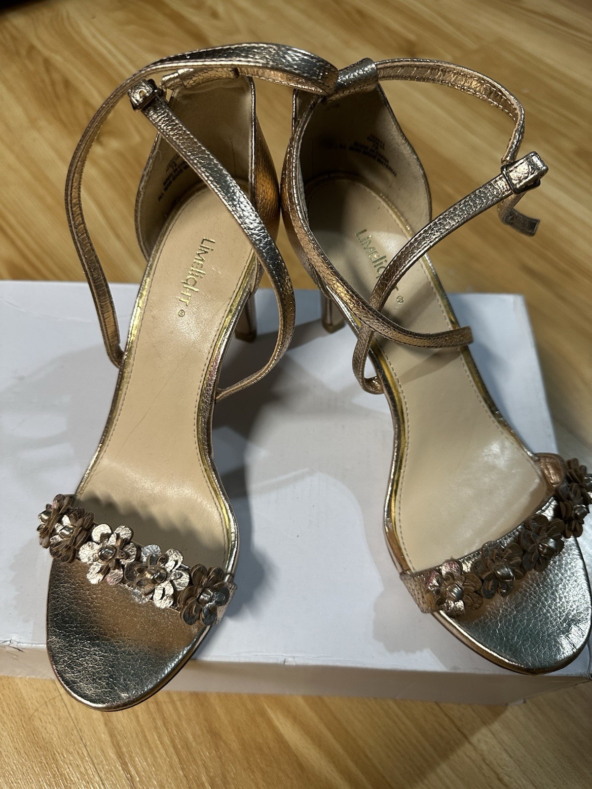 Elegant gold heels with a strappy design. Perfect for stylish events.