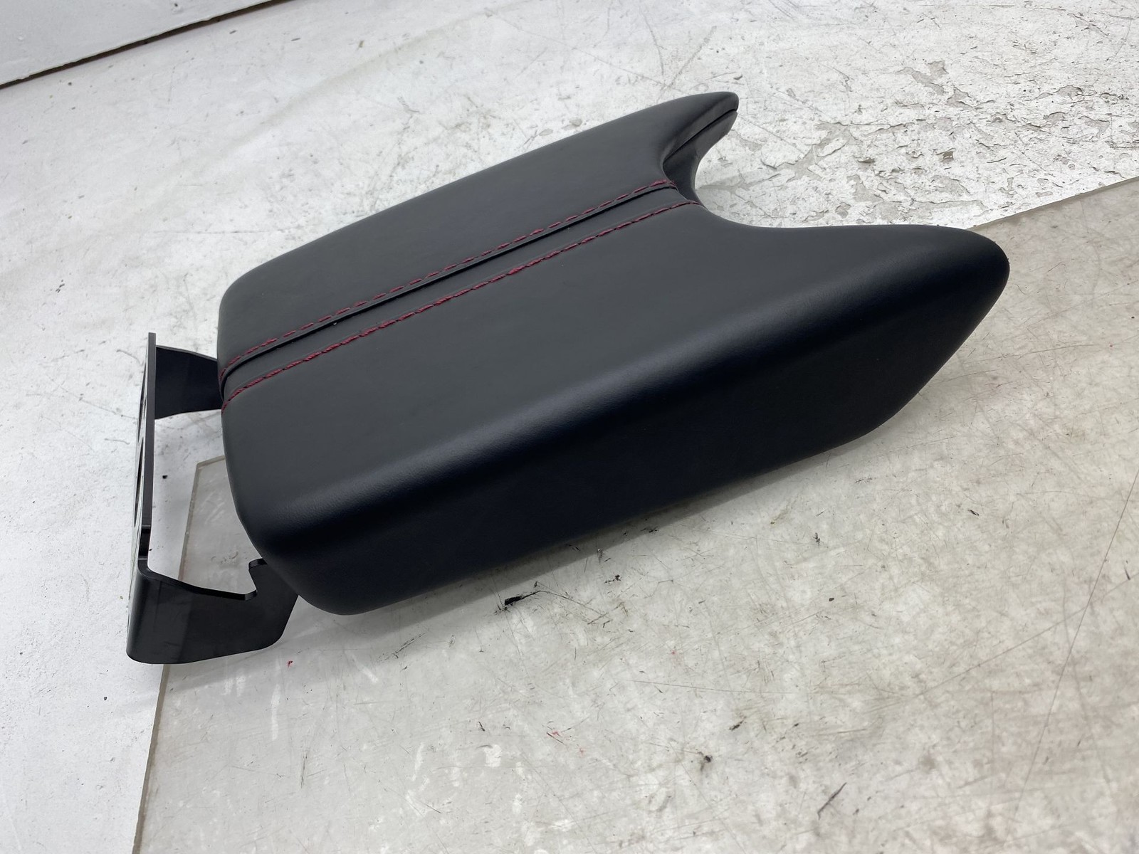 2019-2023 ASTON MARTIN VANTAGE FRONT CENTER CONSOLE LID ARMREST W/RED STITCHING