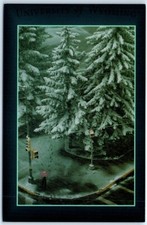 A lone students during a spring snowstorm on campus - University of Wyoming
