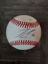 THAIRO ESTRADA AUTOGRAPHED BASEBALL ON USED MINOR LEAGUE BALL. ROCKIES.