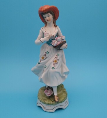 Kontinentale Frau hält Blumen Figur unbekannte Hersteller Marke 7 1/2'' groß