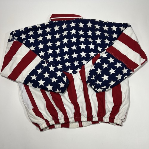 Back zipper of vintage 90s jacket with American flag design featuring blue field with white stars and red and white horizontal stripes.