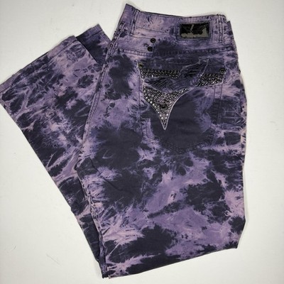 Robin's Jeans feature a vibrant purple and black tie-dye wash